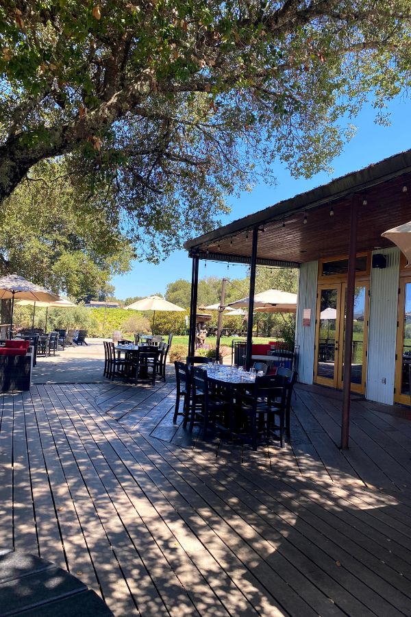 Wilson Winery patio seating with tables and umbrellas - great wineries in Sonoma